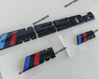 Bmw M550d set, 2 x M emblem for the fenders (45 x 15 mm) + M550d trunk, glossy black, new in foil, lettering, badge, sticker