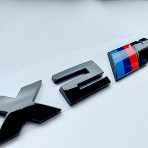 Bmw X2M Emblem Schwarz Glänzend Neuware in Folie, Schriftzug, Badge, Aufkleber