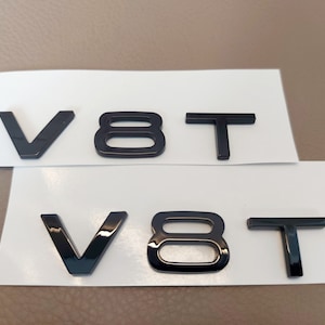 2x V8T emblem, glossy black, new in foil, lettering.....suitable for all Audi models, A6, S1, S3, S4, S5, S6, S7, S8, RS3, RS4, RS6,..