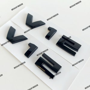 2x BMW V12 emblem, glossy black, new in foil, lettering for many BMW models, 750il, 760il, 850i....