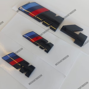 Bmw M4 Set, 2x M für die Kotflügel (45x15mm) + M4 Kofferraum, Emblem Schwarz Glänzend Neuware in Folie, Schriftzug, Badge, Aufkleber