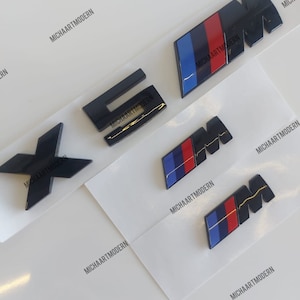 Bmw X5M Set, 2 x M emblem for the fenders (45 x 15 mm) + X5M trunk, black glossy, new in foil, lettering, badge, sticker