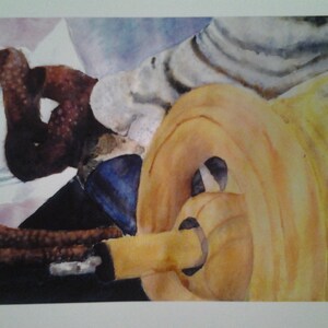 May include: Watercolour painting of a yellow and orange spool of thread with a brown and black object wrapped around it.