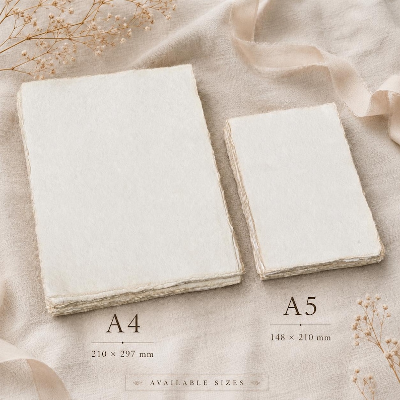 May include: Two stacks of off-white handmade paper with deckled edges. The larger stack is labeled A4 with dimensions 210 x 297 mm, and the smaller stack is labeled A5 with dimensions 148 x 210 mm. The text Available Sizes is printed below.