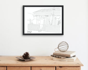 May include: A framed black and white line drawing of a person hanging from a bar in front of a house. The drawing is labeled "Project 3.0 Est. 2022". The frame is displayed on a wooden dresser with decorative items.