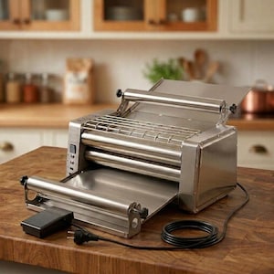 May include: A stainless steel electric dough roller machine featuring two horizontal metal rollers, a top feed tray, a bottom discharge tray, a wire safety guard, a side control panel with buttons, and a black foot pedal connected by a power cord.