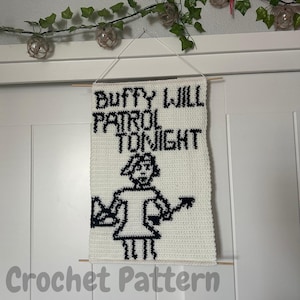May include: White crochet wall hanging with black text that reads "Buffy Will Patrol Tonight" and a black and white pixelated image of a woman with a stake.