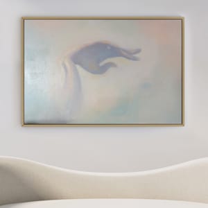 May include: A framed abstract painting with a soft, ethereal feel. The painting features a hand-like shape in shades of purple and gray, set against a background of muted pastel colors.