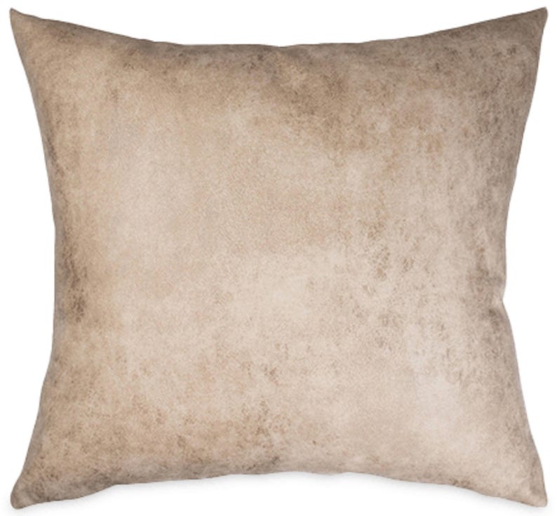 May include: Square decorative pillow with a neutral color palette. The pillow features a textured, mottled design in shades of beige and brown, creating a rustic or vintage aesthetic. The pillow is likely used for home decor.