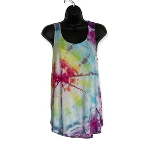 May include: A tie-dye tank top with a rainbow swirl pattern in shades of pink, yellow, blue, and green.