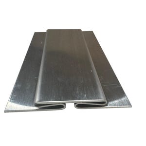 May include: A set of three brushed metal pieces. Two flat, rectangular plates are positioned beneath a U-shaped channel. The metal has a silver color and a matte finish. The pieces are arranged on a white background.