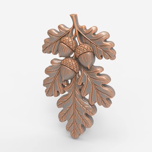 Op de afbeelding: Een bronzen decoratief eikenblad- en eikelontwerp. De afbeelding toont drie eikels en verschillende eikenbladeren, allemaal met gedetailleerde texturen. Het ontwerp is waarschijnlijk bedoeld voor woondecoratie of knutselprojecten.