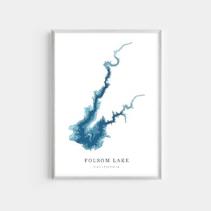 May include: A blue and white contour map of Folsom Lake, California. The map is framed in a silver frame.