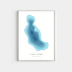May include: A blue and white illustration of Lake Como in Minnesota. The lake is depicted in a layered, topographic style, with shades of blue representing different depths.
