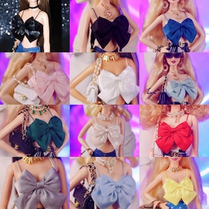 May include: A collection of doll-sized bow-tie tops in various colors, including black, blue, pink, white, green, beige, gray, and yellow. Each top features thin straps and a large bow detail. The tops are displayed on dolls with accessories.