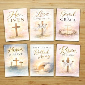 May include: Set of six religious cards with watercolor illustrations. Each card features a cross and inspirational text in gold script, including "He Lives," "Love Conquered All," and "Saved by Grace."