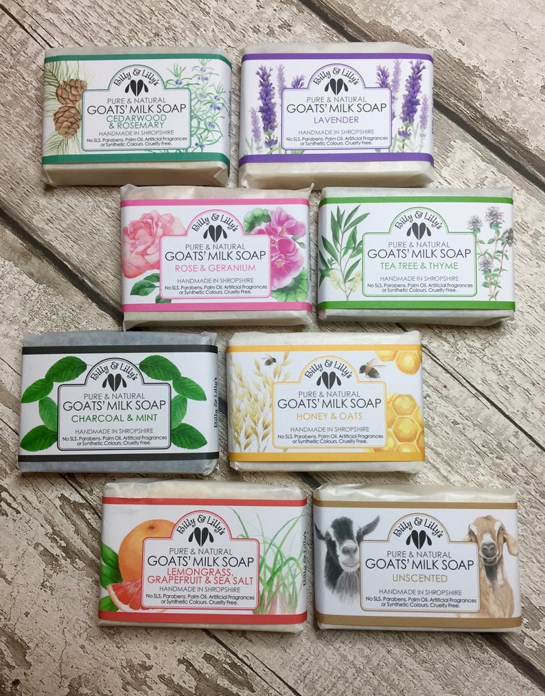 May include: Eight bars of goat milk soap with various scents and ingredients. The soaps are wrapped in paper with illustrations of the scents. The scents include Cedarwood & Rosemary, Lavender, Rose & Geranium, Tea Tree & Thyme, Charcoal & Mint, Honey & Oats, Lemongrass, Grapefruit & Sea Salt, and Unscented.