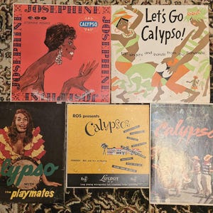 May include: A collection of vintage vinyl records featuring colorful album covers. The records showcase the genre of Calypso music, with titles like "Josephine," "Let's Go Calypso!," and "Calypso with the Playmates." The album art includes illustrations and photographs.