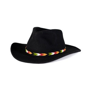 May include: A black felt cowboy hat with a colorful patterned band.