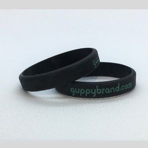 Guppy, Guppy Small Silicone Bands, Black with Teal Inscription, 2-Pack