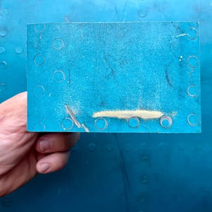 Pilot сollectable gifts fragment from the Russian Su-34 plane shot down over Kharkov on March 6, 2022