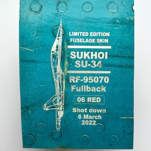 Pilot сollectable gifts fragment from the Russian Su-34 plane shot down over Kharkov on March 6, 2022