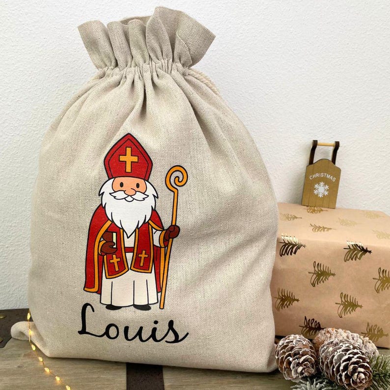 Personalisierter Nikolaussack mit klassischem Nikolaus-Motiv und Name Louis – nachhaltiger Weihnachtssack aus Leinen als Nikolausgeschenk.