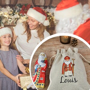 May include: A festive scene with a mother and daughter wearing Santa hats, smiling. A chocolate Santa figure and a drawstring bag with a St. Nicholas illustration and the name "Louis" are also visible, suggesting a holiday theme.