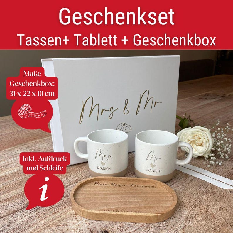 May include: A white gift set with the text "Geschenkset" and "Tassen+ Tablett + Geschenkbox". The set includes two mugs with "Mrs" and "Mr" printed on them, a wooden tray, and a gift box. The box measures 12.2 x 8.7 x 3.9 inches.