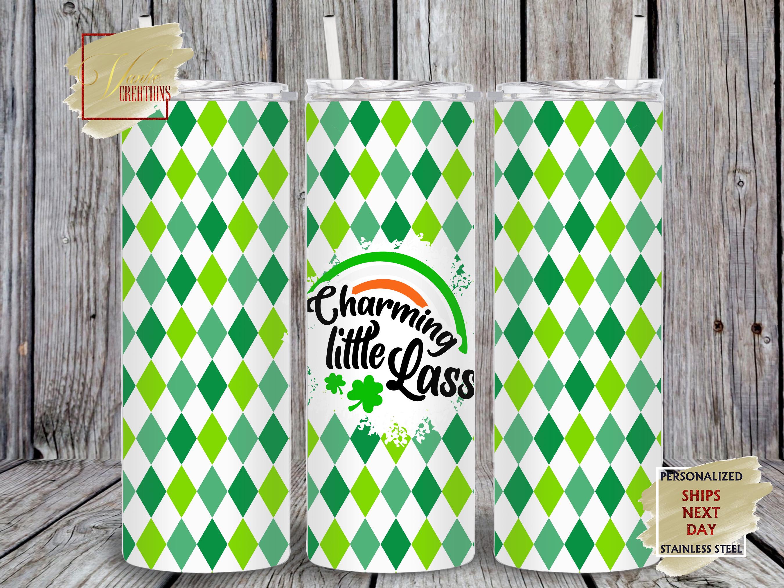 Charming Little Lass Saint Patrick's Day Tumbler Features a green and white diamond background with a charming little lass logo with rainbow