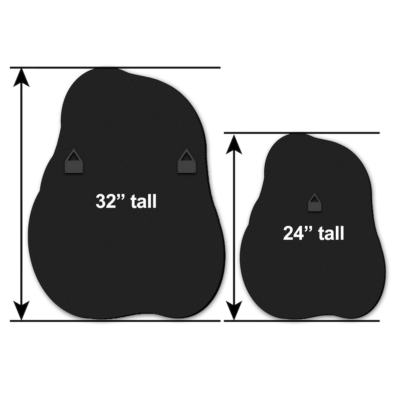 May include: Two black, irregularly shaped wall mirrors with hanging hardware. The larger mirror is 32 inches tall and the smaller mirror is 24 inches tall.