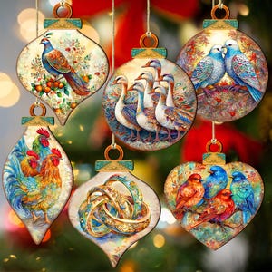 May include: Six colorful Christmas ornaments with various designs. The ornaments feature a peacock, a rooster, a group of geese, two birds, a pair of rings, and three birds. The ornaments are all painted in a realistic style with intricate details.