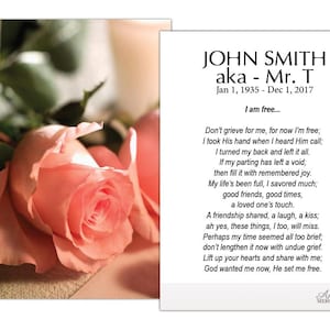 May include: A memorial card with the name "JOHN SMITH" and dates "Jan 1, 1935 - Dec 1, 2017". The card includes a poem and is accompanied by a soft pink rose with green foliage.