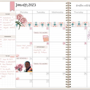 May include: A monthly planner with a pink and green floral design. The planner has a wire-o binding and includes sections for "To Buy", "Reminder", "To Do", and "Video". The planner also includes sections for "Back to Work" and "No School".