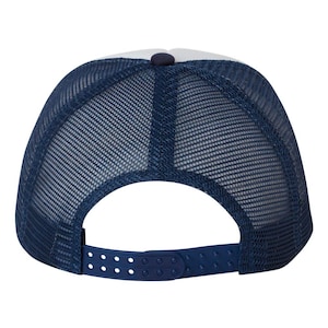 May include: A navy blue trucker hat with a white front panel and a mesh back. The hat features a snapback closure for adjustable sizing. The crown has a button on top. This hat is a classic accessory for casual wear.