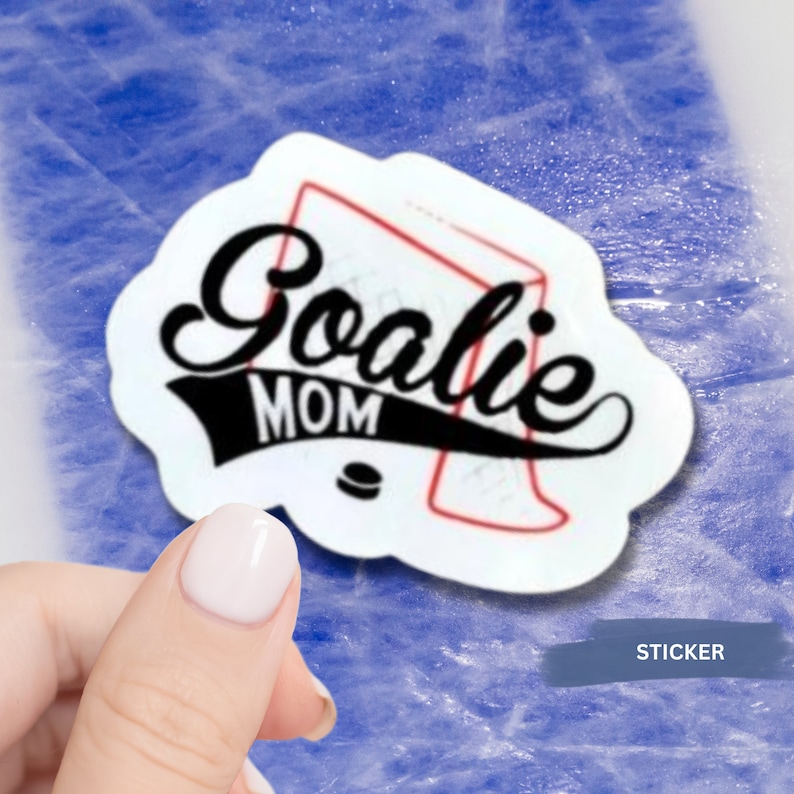 May include: White sticker with black and red text and a red hockey net graphic. The text reads "Goalie Mom".