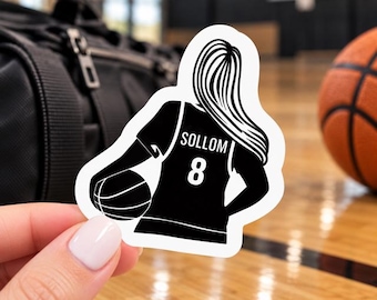 May include: A die-cut sticker featuring a black silhouette of a basketball player with long hair, wearing a jersey with the name SOLLOM and the number 8 printed on the back, while holding a basketball under one arm.