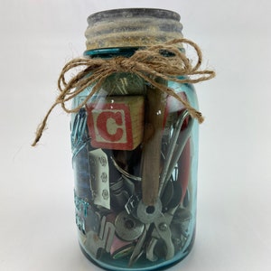 Vintage Ball Quart Jar filled with Vintage Sewing Notions
