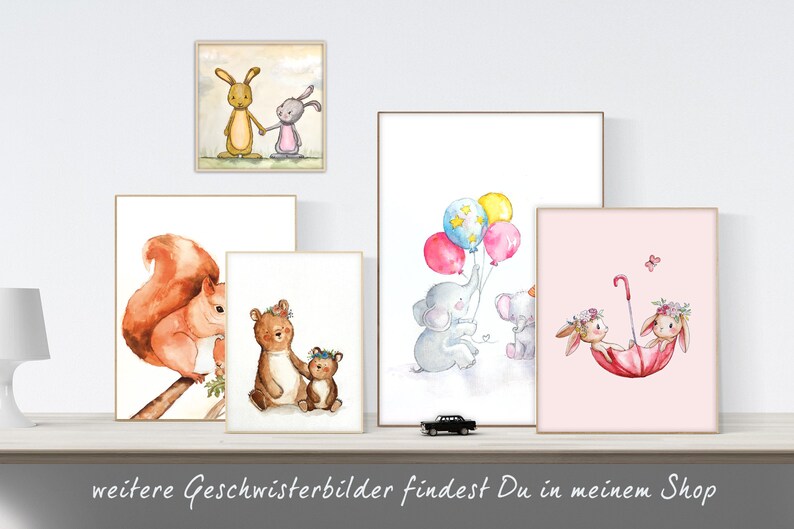 May include: Set of five watercolor prints featuring various animal pairs. The prints depict a squirrel and a squirrel, a bear and a bear cub, two elephants holding balloons, two bunnies holding an umbrella, and two bunnies holding hands.