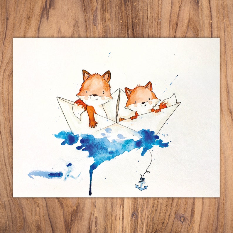 May include: Two orange foxes are sailing in a white paper boat on a blue watercolor background. The boat has a blue anchor attached to it.