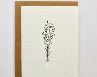 Puede incluir: Un dibujo lineal simple de un ramo de flores silvestres con dos flores en flor. El dibujo está hecho con tinta negra sobre una tarjeta blanca.