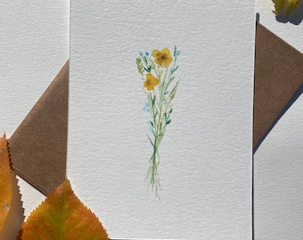 May include: A watercolor painting of a small bouquet of yellow wildflowers with green stems and blue flowers.