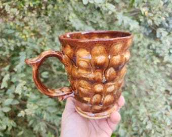 Albany brown and burnt sienna swirly mug with frozen pond glazing and thumb rest