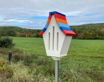 Butterfly House, White with Royal Blue, Red, Orange, and Sky Blue Roof