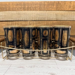 Vasos de highball vintage Jeanette dorados y negros con diseño de estrella, con soporte y caja.