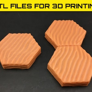 May include: Two 3D printed hexagonal tiles with a sand dune texture. The tiles are orange and are designed for 3D printing.
