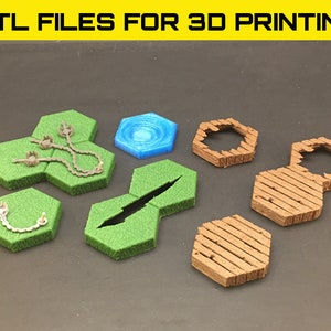May include: A set of 3D printed hexagonal tiles for tabletop gaming. The tiles are made of green and brown plastic and feature different designs, including a pond, a trap, and a wooden walkway.