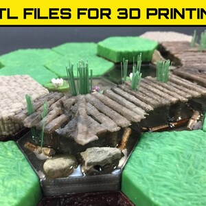 May include: A 3D printed model of a wooden bridge over a stream. The bridge is made of small, rectangular pieces of wood, and the stream is filled with clear resin. The bridge is surrounded by green grass and small trees.