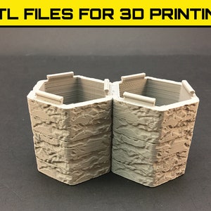 Puede incluir: Dos estructuras hexagonales grises impresas en 3D con una textura de piedra. Las estructuras están apiladas y parecen formar parte de un edificio en miniatura o una maqueta.