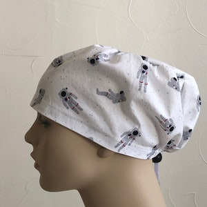 Astronauts with white sparkle scrub cap